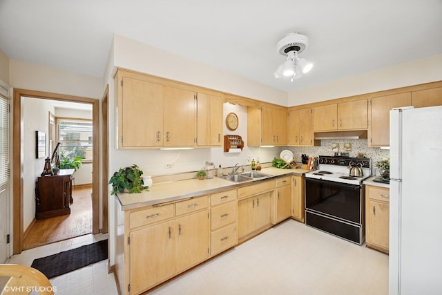 1865 Sunnyside Ave, Westchester, IL 60154 - kitchen with freestanding refrigerator, electric stove, under cabinet range hood, light brown cabinets, and light countertops