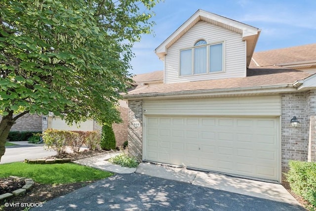 6919 Lexington Ct, Tinley Park, IL 60477 - traditional-style house with concrete driveway, brick siding, a shingled roof, and an attached garage