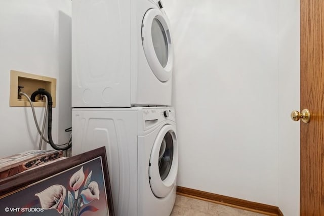 6919 Lexington Ct, Tinley Park, IL 60477 - laundry area featuring stacked washer and clothes dryer and baseboards
