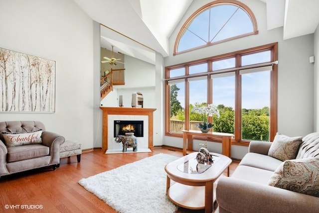 6919 Lexington Ct, Tinley Park, IL 60477 - living area featuring ceiling fan, wood finished floors, healthy amount of natural light, high vaulted ceiling, and a fireplace with flush hearth