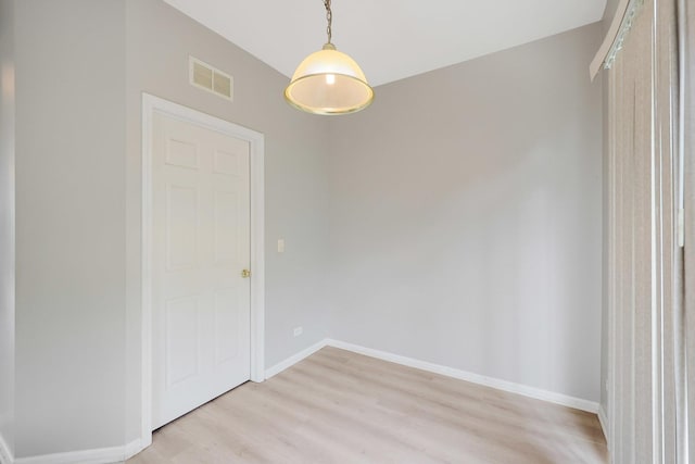 64 Village Station Ln, Grayslake, IL 60030 - unfurnished dining area featuring baseboards and light wood-type flooring