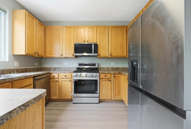 64 Village Station Ln, Grayslake, IL 60030 - kitchen with appliances with stainless steel finishes and light wood-style floors