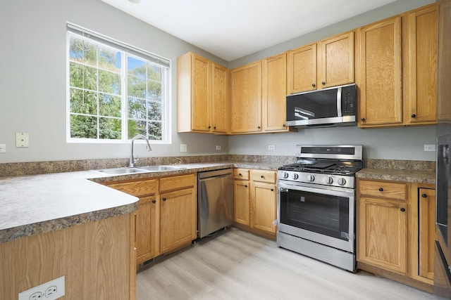 64 Village Station Ln, Grayslake, IL 60030 - kitchen featuring appliances with stainless steel finishes and light wood-style floors