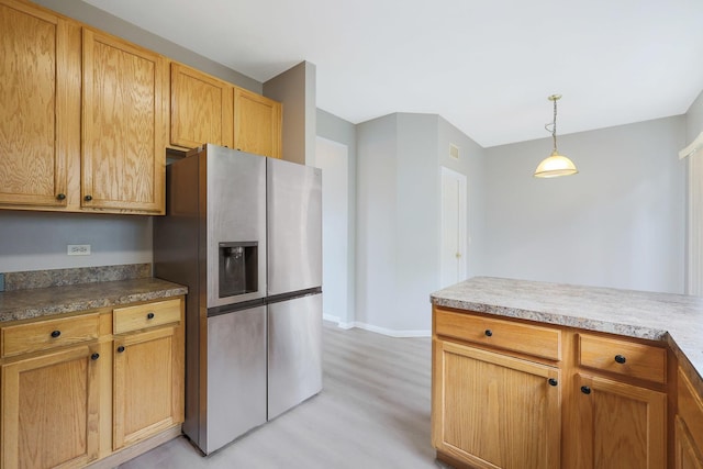 64 Village Station Ln, Grayslake, IL 60030 - kitchen featuring stainless steel fridge, light wood-style floors, and decorative light fixtures