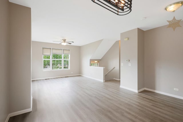 64 Village Station Ln, Grayslake, IL 60030 - unfurnished living room featuring wood finished floors and a ceiling fan