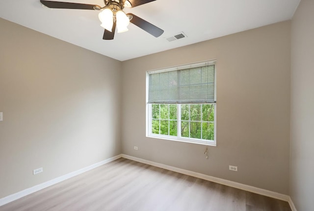 64 Village Station Ln, Grayslake, IL 60030 - unfurnished room with light wood-style floors and a ceiling fan