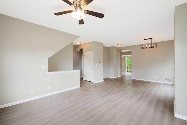 64 Village Station Ln, Grayslake, IL 60030 - unfurnished living room featuring light wood-type flooring and a ceiling fan