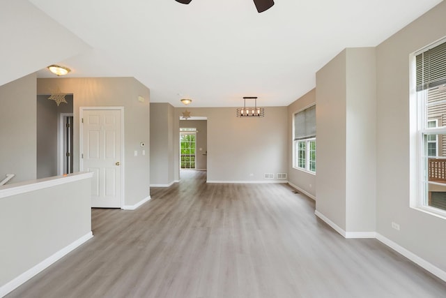 64 Village Station Ln, Grayslake, IL 60030 - spare room featuring ceiling fan, light wood-style flooring, and healthy amount of natural light