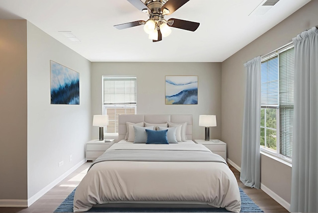 64 Village Station Ln, Grayslake, IL 60030 - bedroom with wood finished floors and a ceiling fan