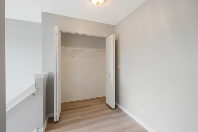 64 Village Station Ln, Grayslake, IL 60030 - unfurnished bedroom featuring a closet and light wood-style flooring