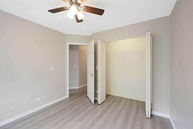 64 Village Station Ln, Grayslake, IL 60030 - unfurnished bedroom with light wood finished floors, a closet, and a ceiling fan