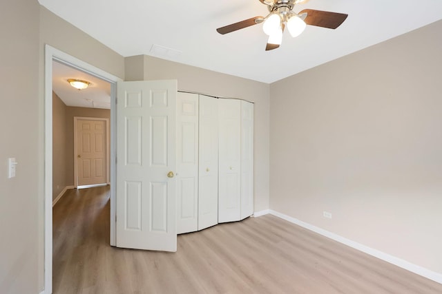 64 Village Station Ln, Grayslake, IL 60030 - unfurnished bedroom with light wood-type flooring, a closet, and ceiling fan