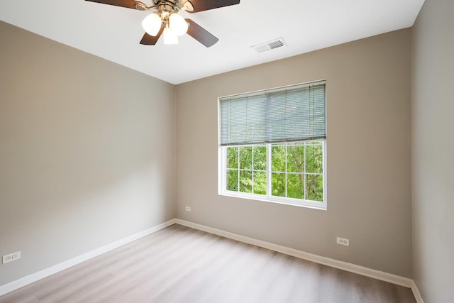 64 Village Station Ln, Grayslake, IL 60030 - unfurnished room featuring wood finished floors and ceiling fan