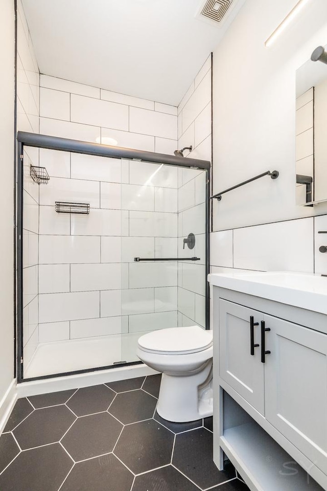 2244 S Sawyer Ave, Chicago, IL 60623 - bathroom with a shower stall, vanity, and tile patterned flooring