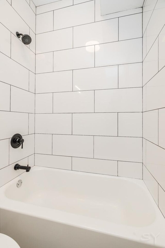 2244 S Sawyer Ave, Chicago, IL 60623 - bathroom featuring bathing tub / shower combination and toilet