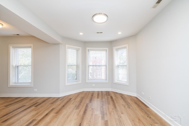 2244 S Sawyer Ave, Chicago, IL 60623 - empty room featuring light wood-style flooring, plenty of natural light, and recessed lighting
