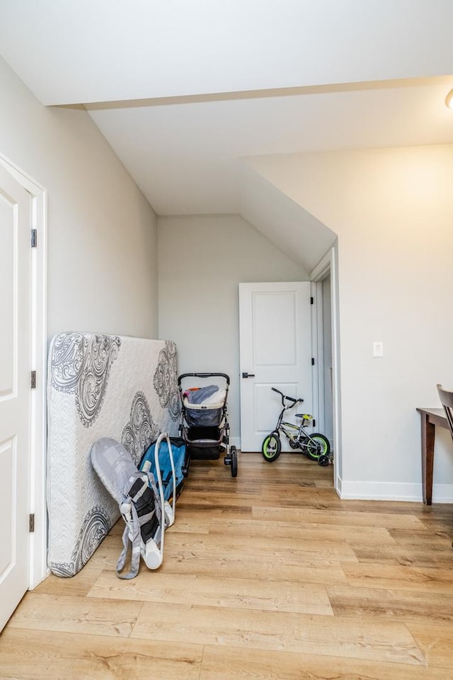 2244 S Sawyer Ave, Chicago, IL 60623 - unfurnished room with light wood finished floors and vaulted ceiling