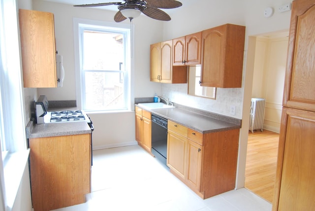 6207 N Winthrop Ave Unit 30, Chicago, IL 60660 - kitchen featuring black dishwasher, radiator, ceiling fan, and decorative backsplash