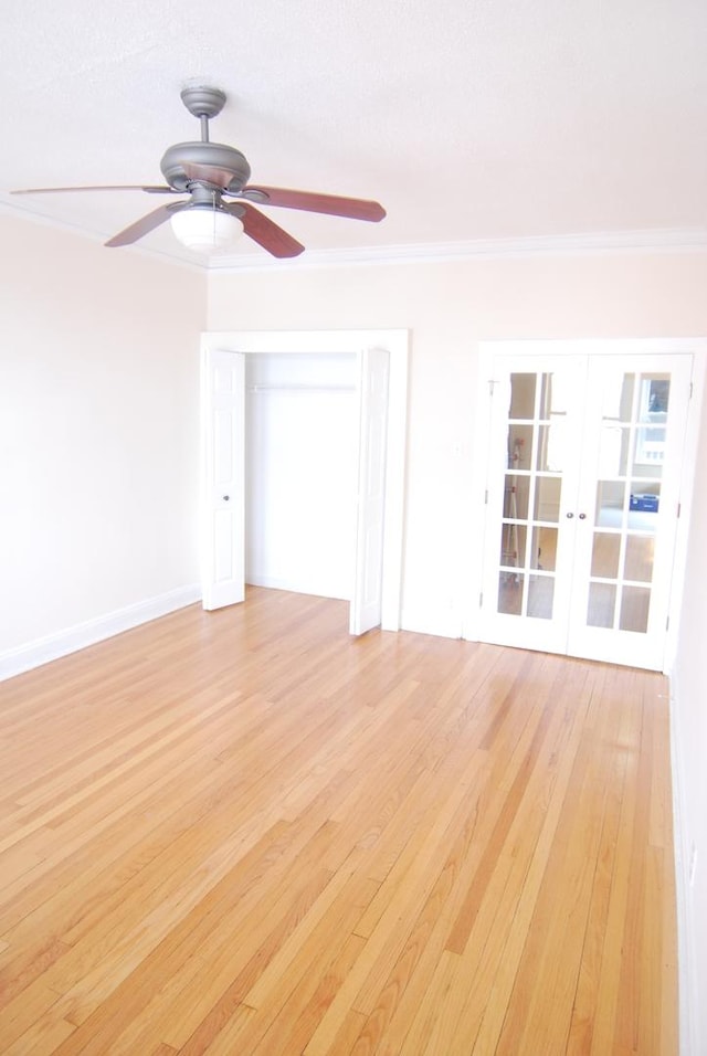6207 N Winthrop Ave Unit 30, Chicago, IL 60660 - spare room featuring ornamental molding, light wood-style floors, and a ceiling fan