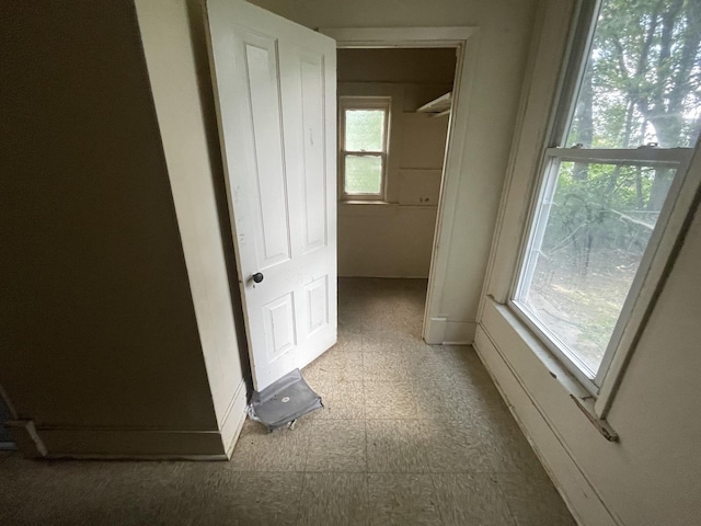 1644 E William St, Decatur, IL 62521 - corridor featuring tile patterned floors and baseboards