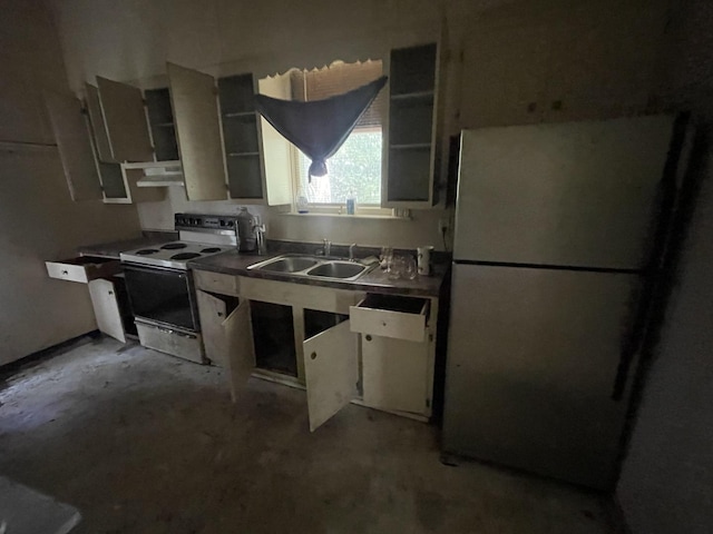 1644 E William St, Decatur, IL 62521 - kitchen with white range with electric cooktop, freestanding refrigerator, concrete flooring, and under cabinet range hood