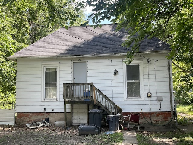 1644 E William St, Decatur, IL 62521 - rear view of house with a shingled roof and crawl space