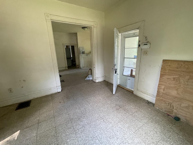 1644 E William St, Decatur, IL 62521 - unfurnished bedroom featuring baseboards and tile patterned floors