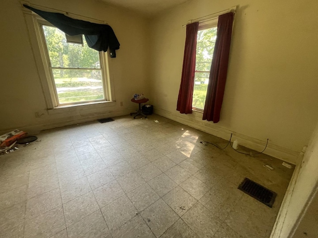 1644 E William St, Decatur, IL 62521 - unfurnished room featuring tile patterned floors and baseboards