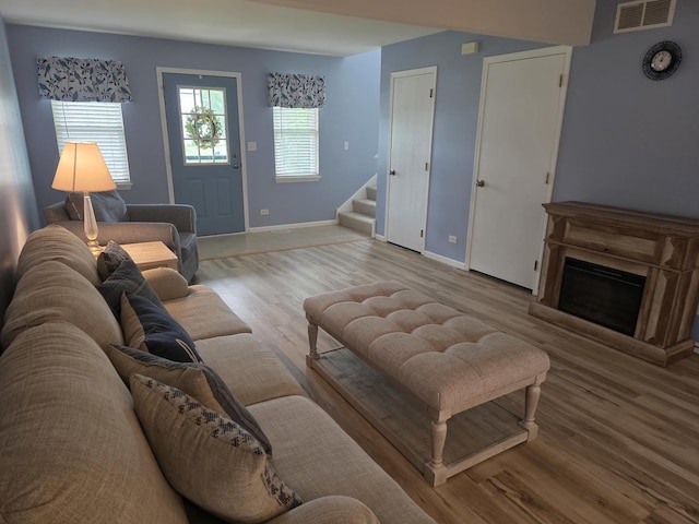 415 Andrea Ct, Harvard, IL 60033 - living area with wood finished floors, stairway, and a fireplace