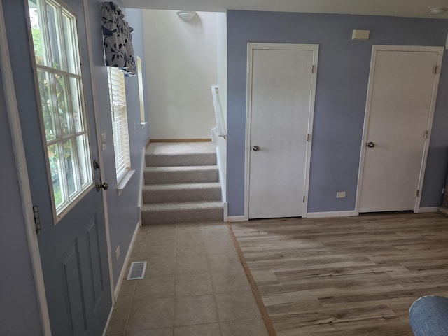 415 Andrea Ct, Harvard, IL 60033 - entryway featuring stairs and tile patterned flooring