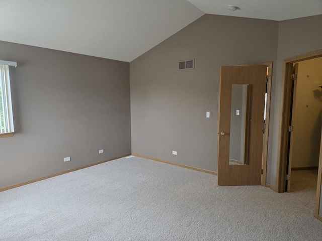 415 Andrea Ct, Harvard, IL 60033 - empty room with vaulted ceiling, a smoke detector, and carpet floors