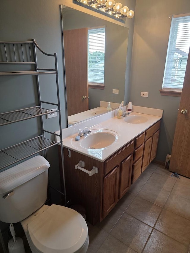 415 Andrea Ct, Harvard, IL 60033 - bathroom featuring double vanity and tile patterned flooring