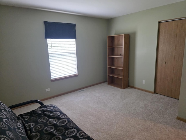 415 Andrea Ct, Harvard, IL 60033 - bedroom with light carpet and a closet