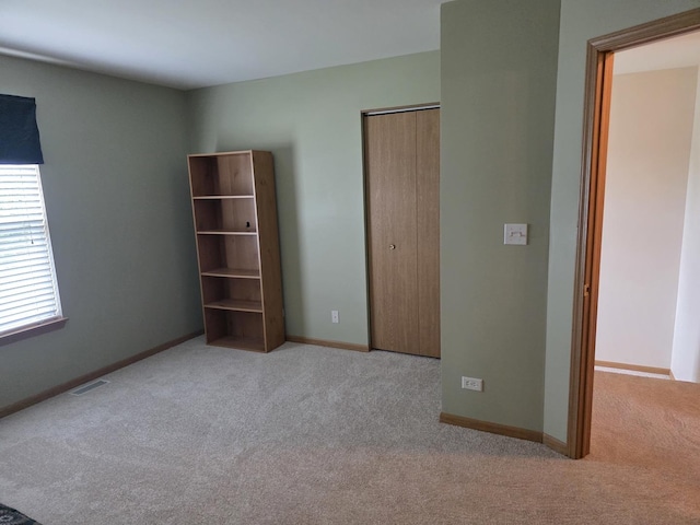 415 Andrea Ct, Harvard, IL 60033 - unfurnished bedroom featuring carpet flooring and a closet