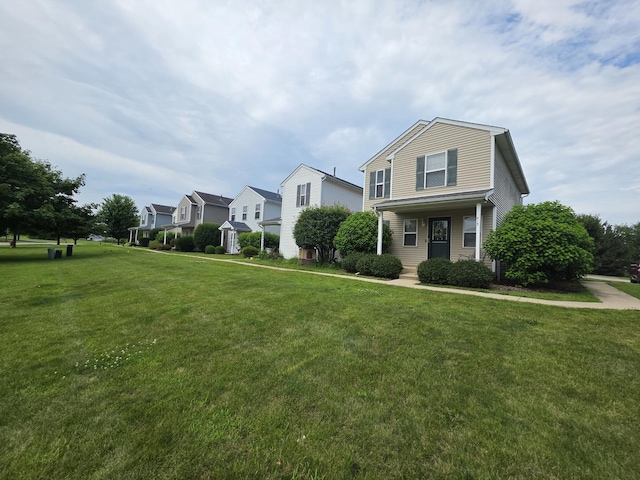 415 Andrea Ct, Harvard, IL 60033 - traditional-style house featuring a front lawn and a residential view