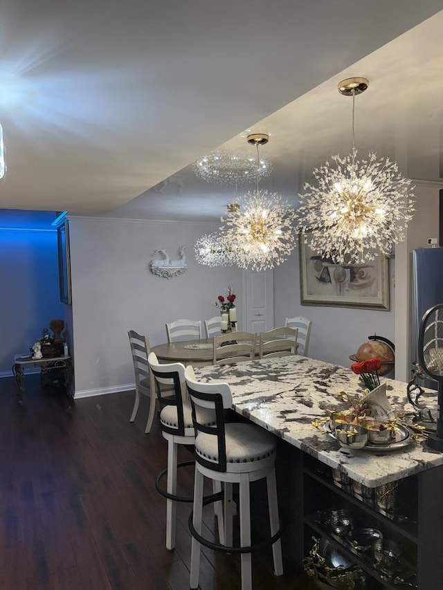 11A Kingery Quarter Unit 202, Willowbrook, IL 60527 - dining area featuring a chandelier and wood finished floors