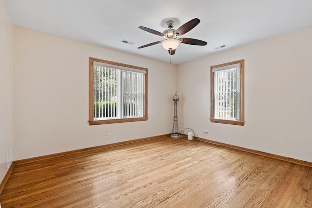 6759 W 91st St, Oak Lawn, IL 60453 - empty room featuring healthy amount of natural light, light wood-type flooring, and ceiling fan