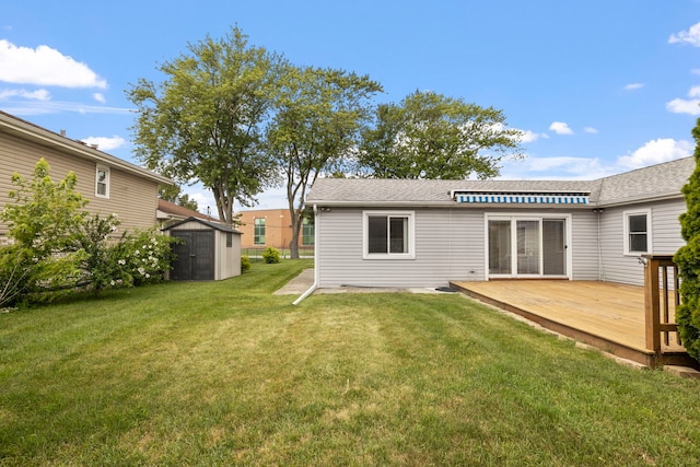 6759 W 91st St, Oak Lawn, IL 60453 - rear view of house featuring a storage shed, a deck, a lawn, and roof with shingles