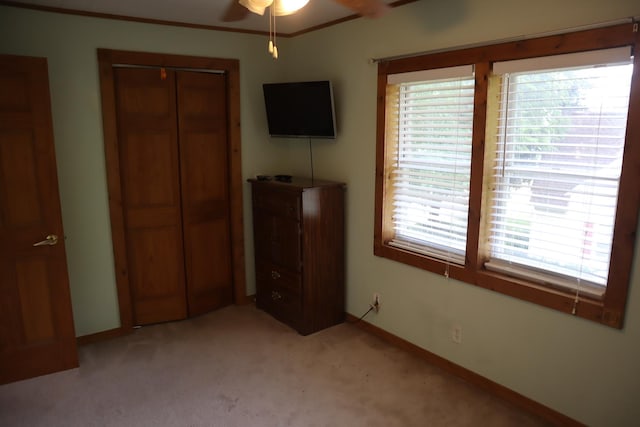 207 E N St, Walnut, IL 61376 - unfurnished bedroom featuring a closet and light colored carpet