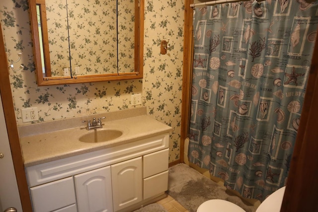 207 E N St, Walnut, IL 61376 - bathroom featuring wallpapered walls, vanity, and tile patterned floors