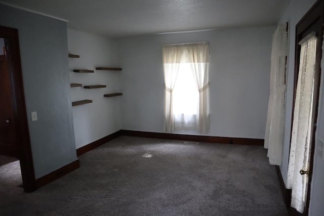 207 E N St, Walnut, IL 61376 - empty room featuring carpet and baseboards