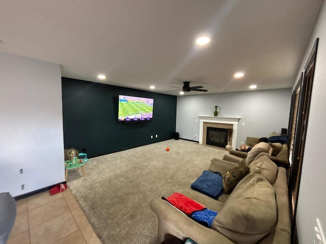 2952 Blue Oats Dr, Rockford, IL 61102 - carpeted home theater with recessed lighting, a ceiling fan, a glass covered fireplace, and tile patterned floors