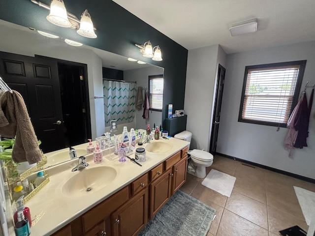2952 Blue Oats Dr, Rockford, IL 61102 - full bath with double vanity, tile patterned floors, and curtained shower