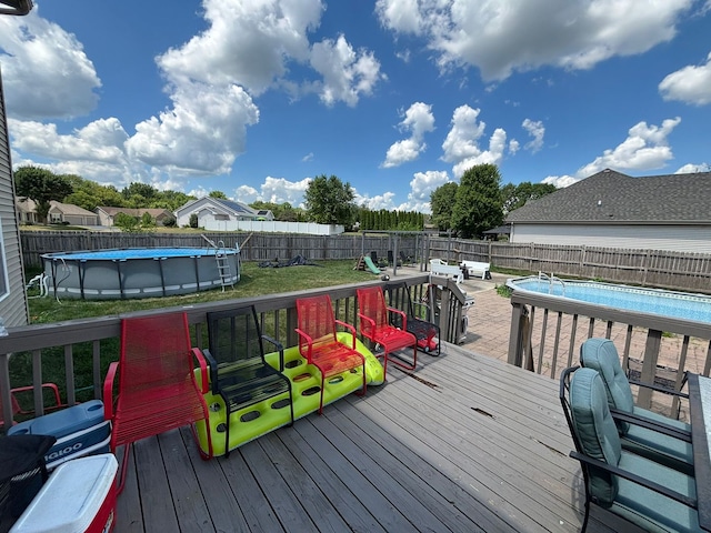 2952 Blue Oats Dr, Rockford, IL 61102 - wooden terrace with a fenced backyard