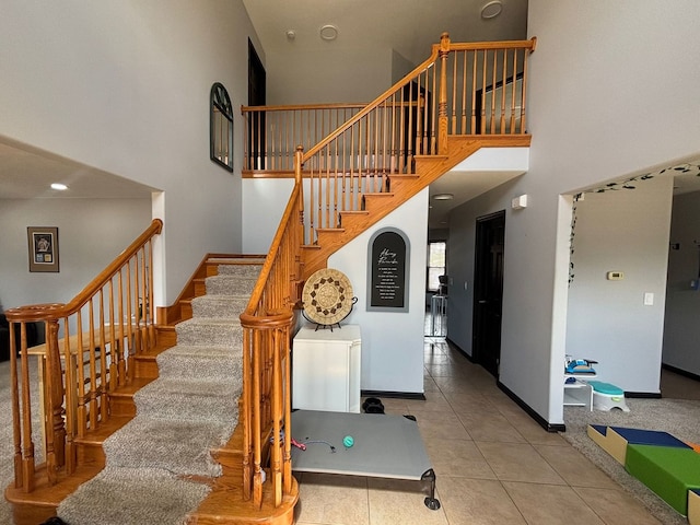 2952 Blue Oats Dr, Rockford, IL 61102 - stairs with a towering ceiling and tile patterned floors