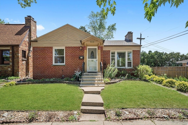 5145 Lee St, Skokie, IL 60077 - view of front of property featuring a chimney and brick siding