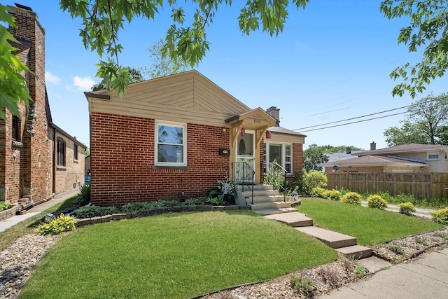 5145 Lee St, Skokie, IL 60077 - bungalow-style house featuring a chimney and brick siding
