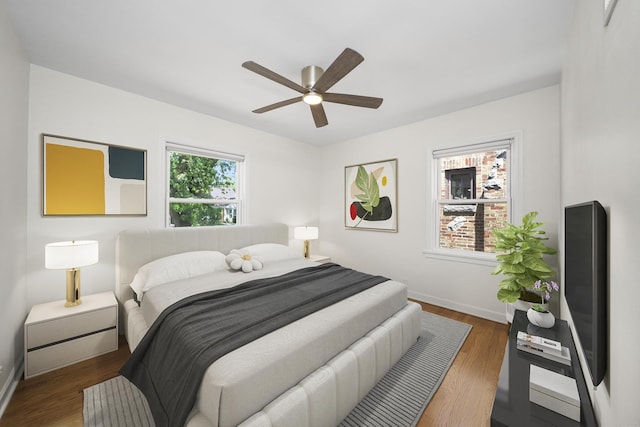 5145 Lee St, Skokie, IL 60077 - bedroom with wood finished floors and a ceiling fan