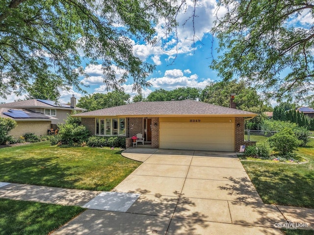 8349 Cristina Ave, Orland Park, IL 60462 - view of front of property with a garage, driveway, brick siding, and a chimney
