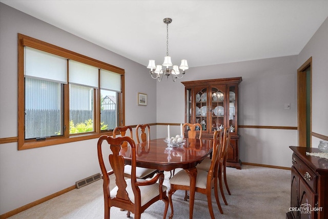 8349 Cristina Ave, Orland Park, IL 60462 - dining room with a chandelier and light carpet